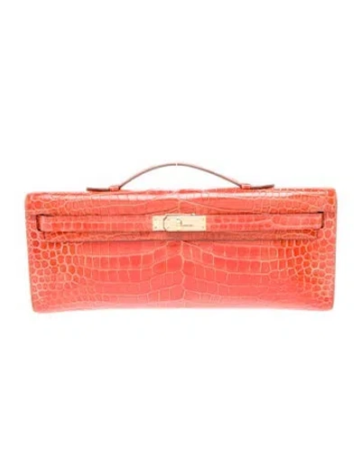 Pre-owned Hermes Shiny Porosus Crocodile Kelly Cut Clutch In Orange