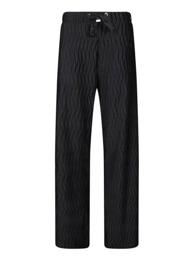 HERNO EMBOSSED JERSEY PANTS IN BLACK