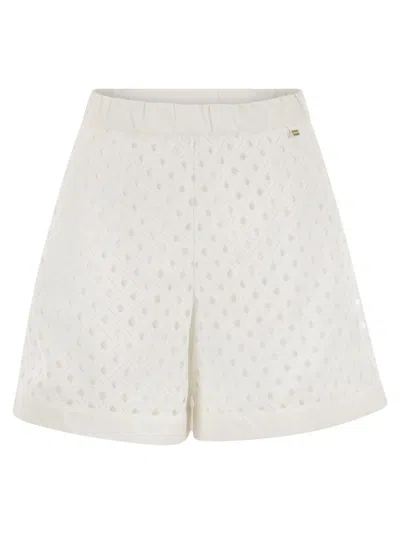 HERNO PERFORATED SHORTS WITH GEOMETRIC SHAPES