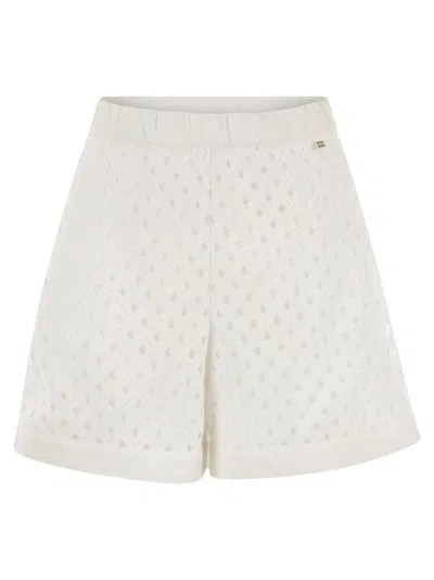 HERNO PERFORATED SHORTS WITH GEOMETRIC SHAPES