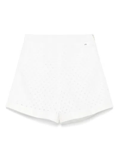 HERNO HERNO PERFORATED SHORTS WITH GEOMETRIC SHAPES