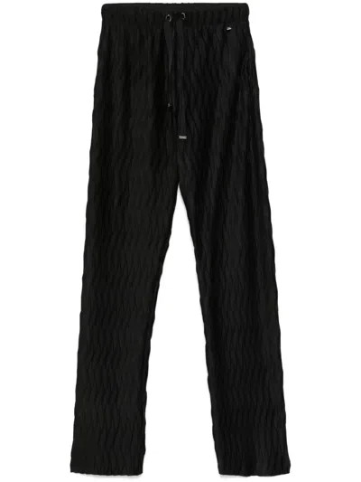 HERNO PLISSÉ TAPERED TROUSERS