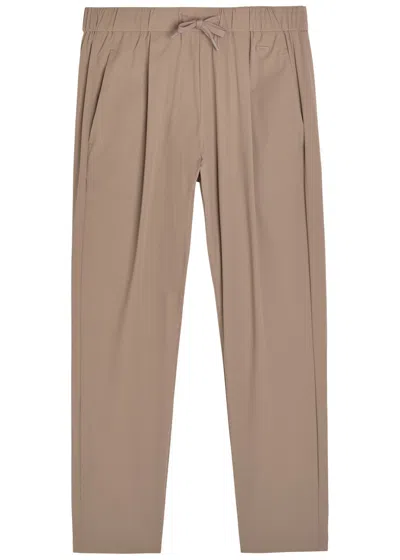 Herno Tapered-leg Stretch-shell Trousers In Brown