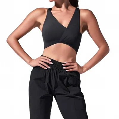 Heroine Sport Twisted Symmetric Neck Top In Black