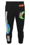 Heron Preston All-over Printed Trousers In Black