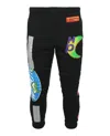 Heron Preston All-over Printed Trousers In Black