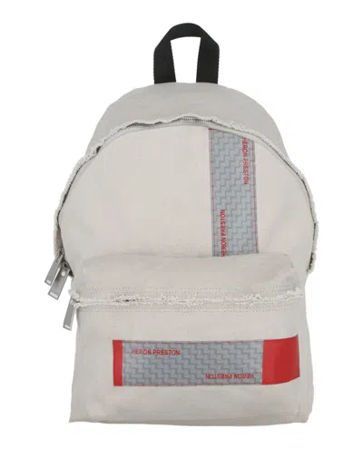 Heron Preston Logo-tape Distressed Backpack In Beige