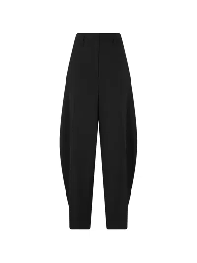 Herskind Dante Pleat-detail Tapered Trousers In Black