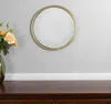 Hivvago 10" Gold Round Iron Textured Framed Accent Mirror In Gold