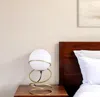 Hivvago 14" Gold Metal Geo Spiral Bedside Lamp With White Globe Shade In White