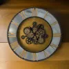 Hivvago 28 Inch Hanging Wall Clock, Round Gear Design, Gold And Black Iron Frame In Gray