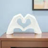 Hivvago 4" White Resin Heart Hands Tabletop Sculpture In White