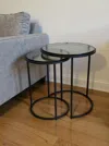 Hivvago Set Of Two Clear And Metal Glass And Iron Round Frame Nested Tables In Black