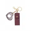 Hobo Lipstick Keychain In Frosted Plum In Brown