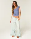 Hollister Ultra Low-rise Distressed Floral Graphic Drapey Beyond Baggy Jeans In Light Wash