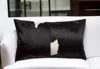 Homezia 12" X 20" Black And White Cowhide Throw Pillow