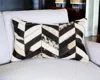 Homezia 12" X 20" Black Brown And Off White Chevron Cowhide Throw Pillow