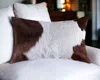 Homezia 12" X 20" Brown And White Cowhide Throw Pillow