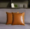 Homezia Set Of 2 Solid Caramel Brown Faux Leather Pillow Covers