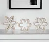 Homezia Set Of Three 7" Brown And White Polyresin Flower Figurine