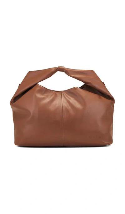 House Of Sunny X Revolve Sling Bag In 초콜렛