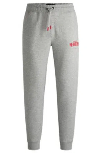 HUGO BOSS BOSS X NFL SIGNATURE-TAPE TRACKSUIT BOTTOMS WITH SPECIAL BRANDING