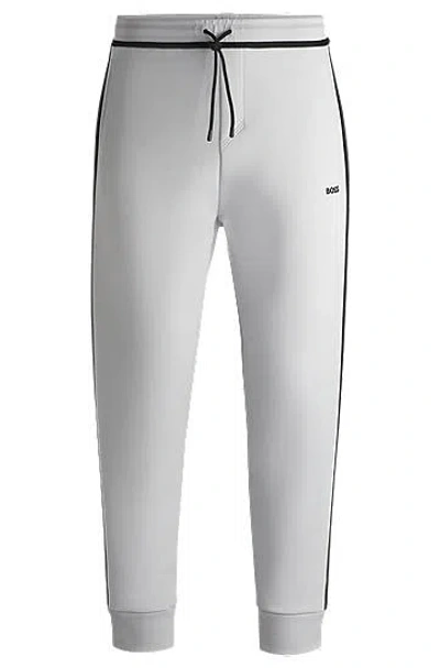 Hugo Boss Cotton-blend Tracksuit Bottoms With Tape And Logo In Light/pastel Grey