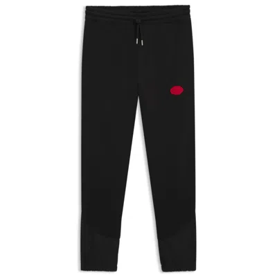 Hugo Boss Cotton-blend Tracksuit Bottoms With Waxed-stamp Logo In Black