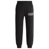 Hugo Boss Cotton-terry Tracksuit Bottoms With Chain-stitch Logo In Black