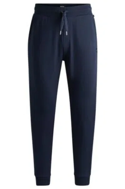 Hugo Boss Cotton-terry Tracksuit Bottoms With Double Monogram In Dark Blue