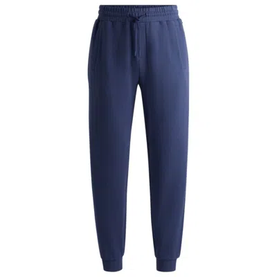 Hugo Boss Cotton-terry Tracksuit Bottoms With Flocked Logo In Blue