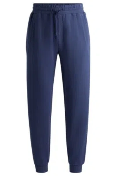 Hugo Boss Cotton-terry Tracksuit Bottoms With Flocked Logo In Blue