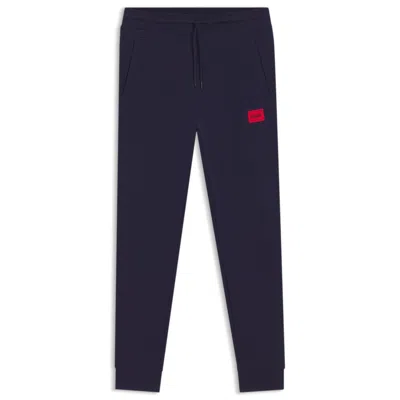Hugo Boss Cotton-terry Tracksuit Bottoms With Logo Label In Blue
