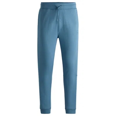 HUGO BOSS COTTON-TERRY TRACKSUIT BOTTOMS WITH LOGO PATCH