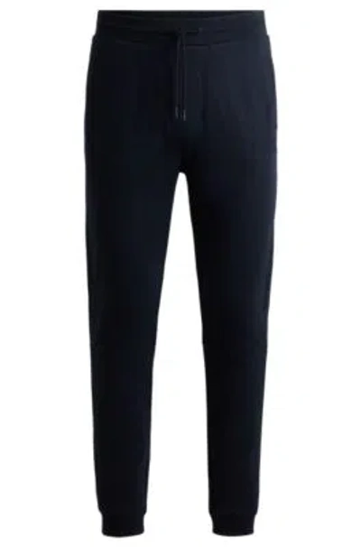 Hugo Boss Cotton-terry Tracksuit Bottoms With Logo Patch In Dark Blue