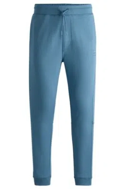 Hugo Boss Cotton-terry Tracksuit Bottoms With Logo Patch In Light Blue