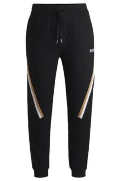 Hugo Boss Cotton-terry Tracksuit Bottoms With Signature-stripe Tape In Black