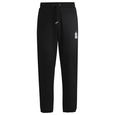 HUGO BOSS COTTON-TERRY TRACKSUIT BOTTOMS WITH SMOKE LOGO