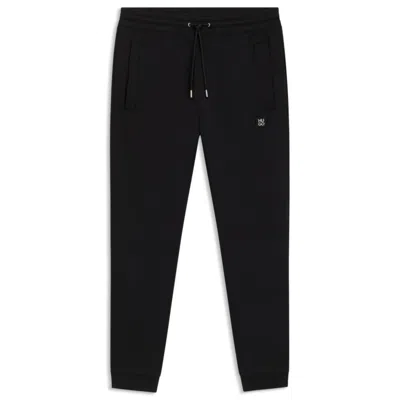 Hugo Boss Cotton Tracksuit Bottoms With Stacked Logo In Black