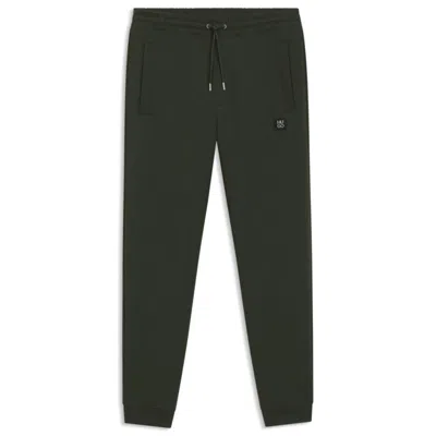 Hugo Boss Cotton Tracksuit Bottoms With Stacked Logo In Green