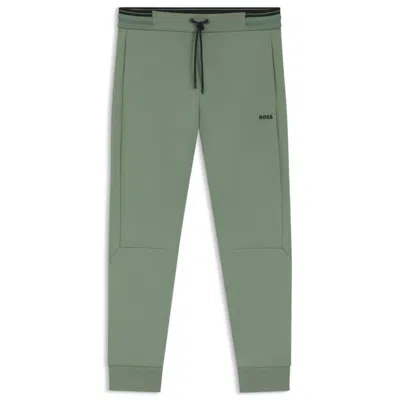 Hugo Boss Cotton Tracksuit Bottoms With Striped Trims In Green