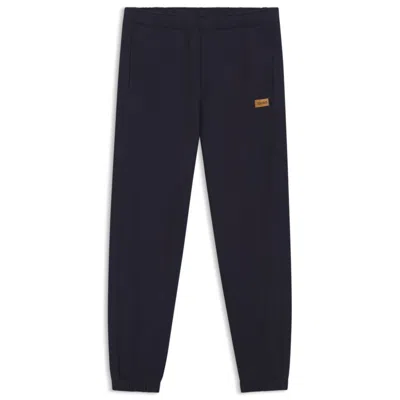 Hugo Boss Cotton-terry Sweatpants With Logo Badge In Blue