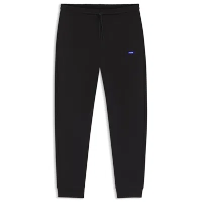Hugo Boss Cotton-terry Sweatpants With Logo Patch In Black