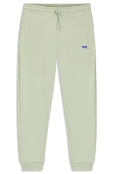 Hugo Boss Cotton-terry Sweatpants With Logo Patch In Green
