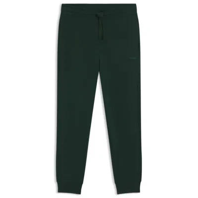 Hugo Boss Cuffed Tracksuit Bottoms In Cotton Terry With Logo Print In Green