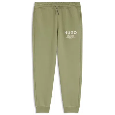 Hugo Boss Logo-print Tracksuit Bottoms In Cotton Terry In Green