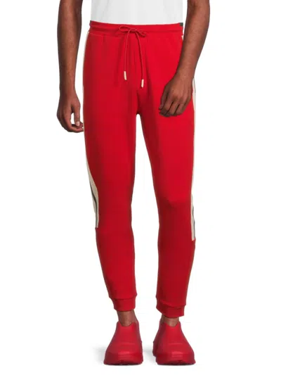 Hugo Boss Tracksuit Bottoms With Tape Inserts In Light Red
