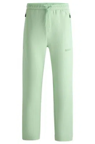 Hugo Boss Open-hem Tracksuit Bottoms With 3d-molded Logo In Light Green