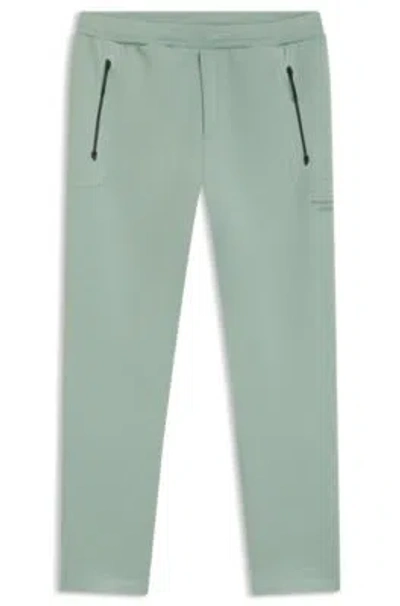 Hugo Boss Porsche X Track Pants With Tonal Reflective Branding In Green