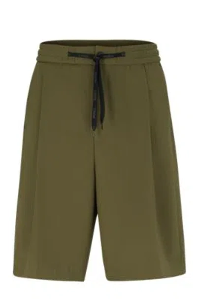 HUGO BOSS RELAXED-FIT SHORTS IN STRUCTURED PERFORMANCE-STRETCH FABRIC